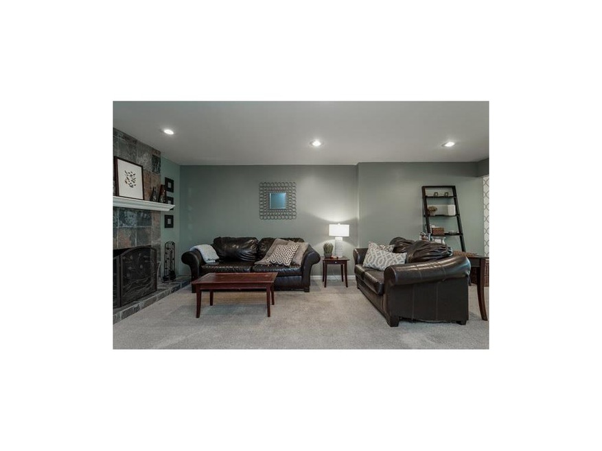 A warm and inviting living room greats you just of