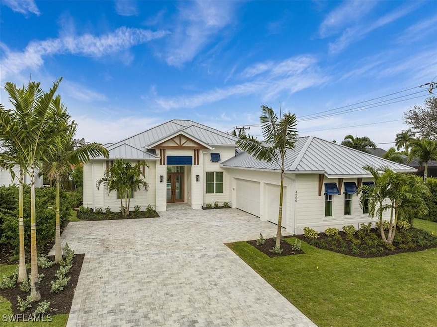 Exterior features include metal roofing, decorativ