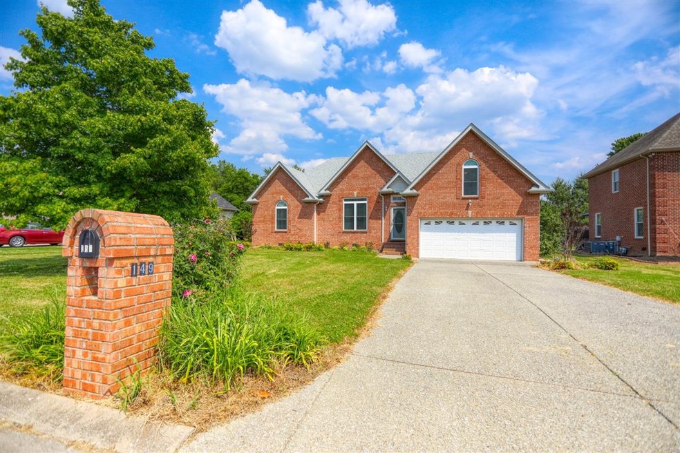 Curbside view. Plenty of parking spaces inside and outside of the garage.