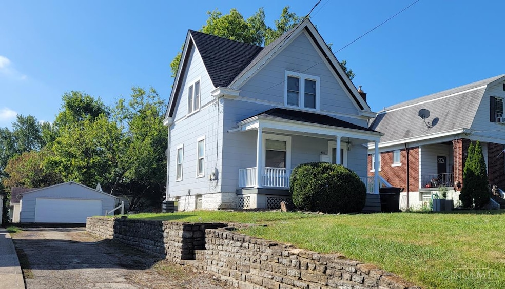 Front exterior has a beautifully maintained stone retaining wall and lovely porch  for entertaining.