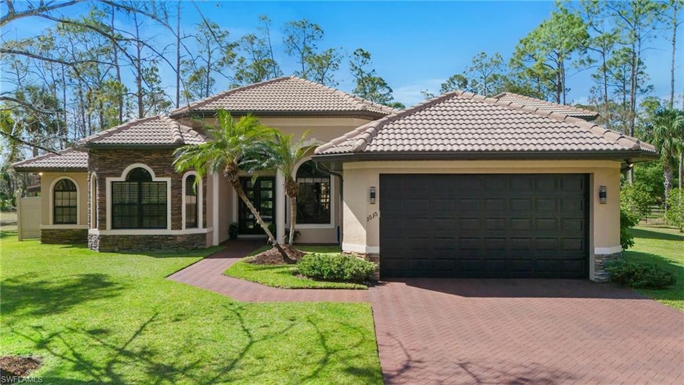 Main home featuring an attached double garage, a t