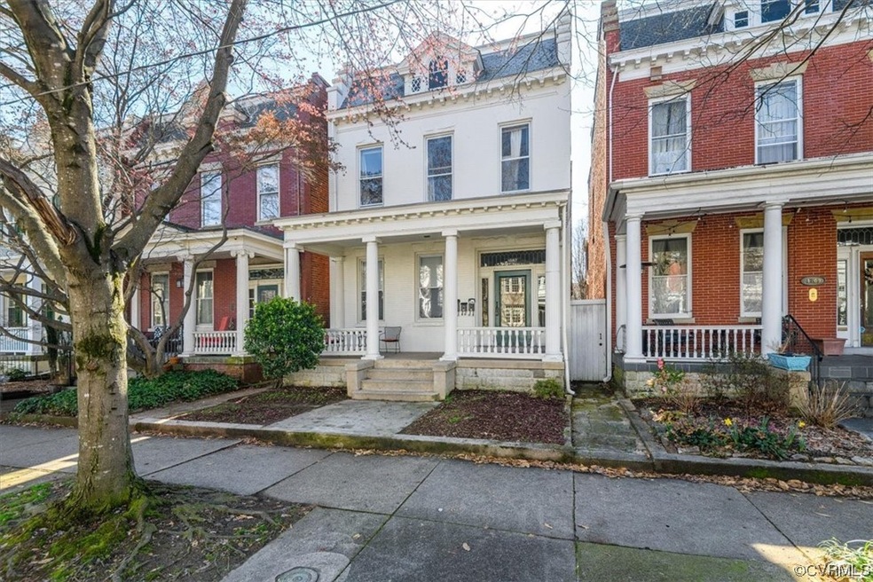 View of property featuring a porch