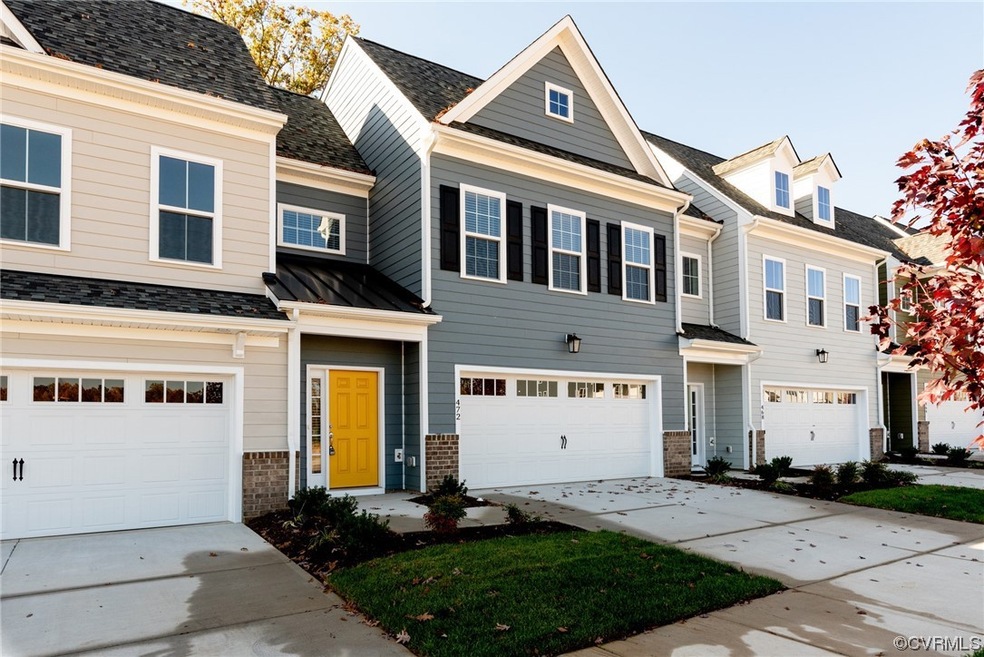 View of front facade featuring a garage