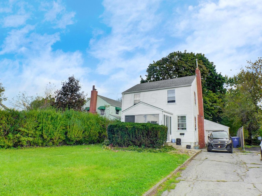 Front view with screened in porch.