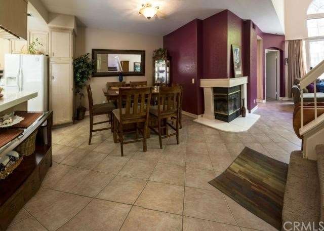 Open floorplan with wrap around fireplace and grea