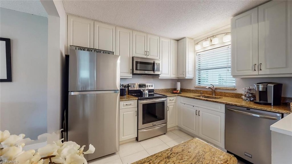 Sunny kitchen window with modern lighting