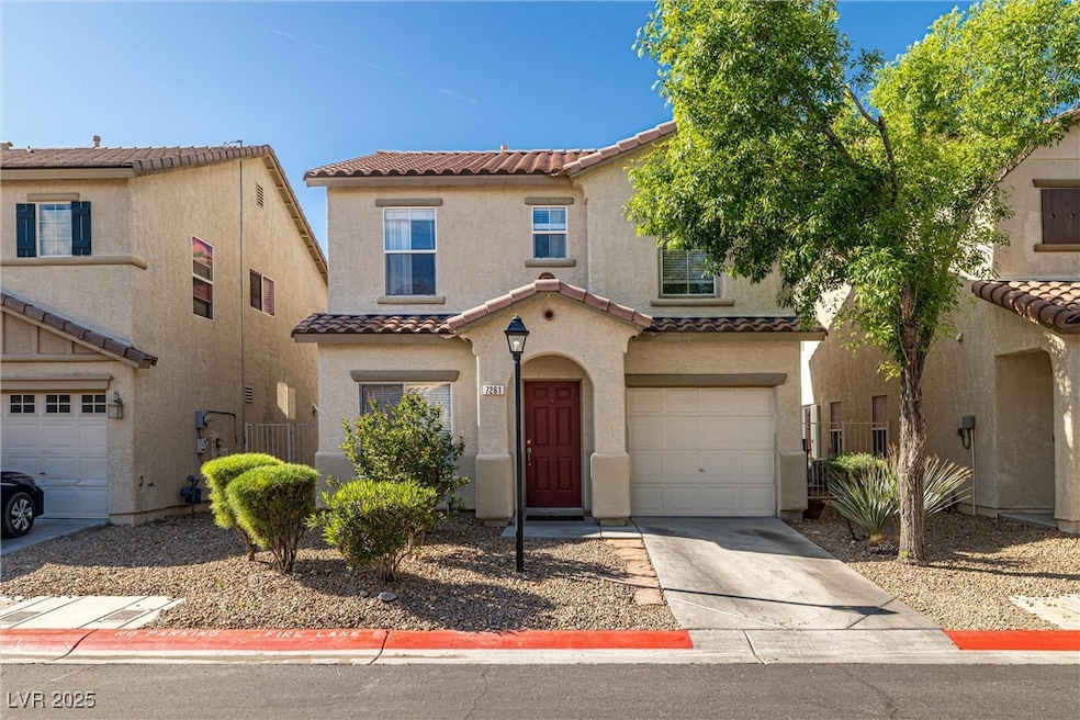 Mediterranean / spanish-style home with driveway,