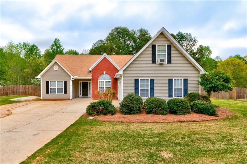 Sitting on 1 acre with a private, wooded backyard 
