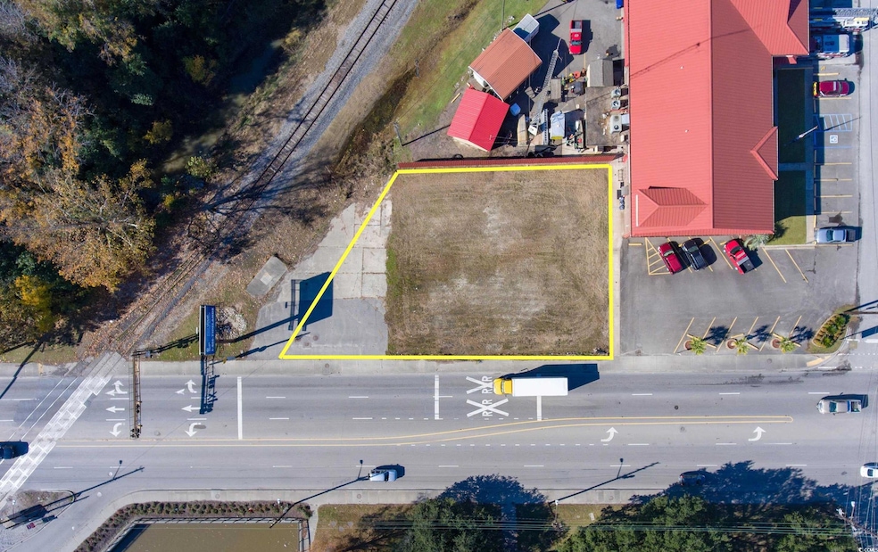 Aerial view of property's location featuring property parcel outlined