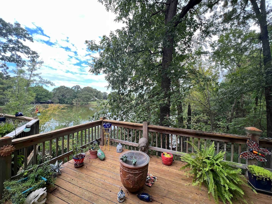 Wooden terrace featuring a water view