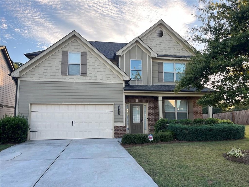 Craftsman inspired home with a garage and a front 