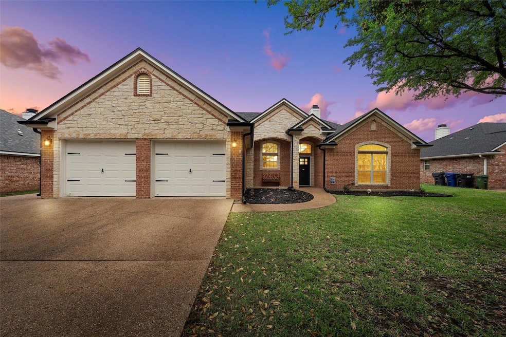 Traditional-style house featuring a yard, stone si