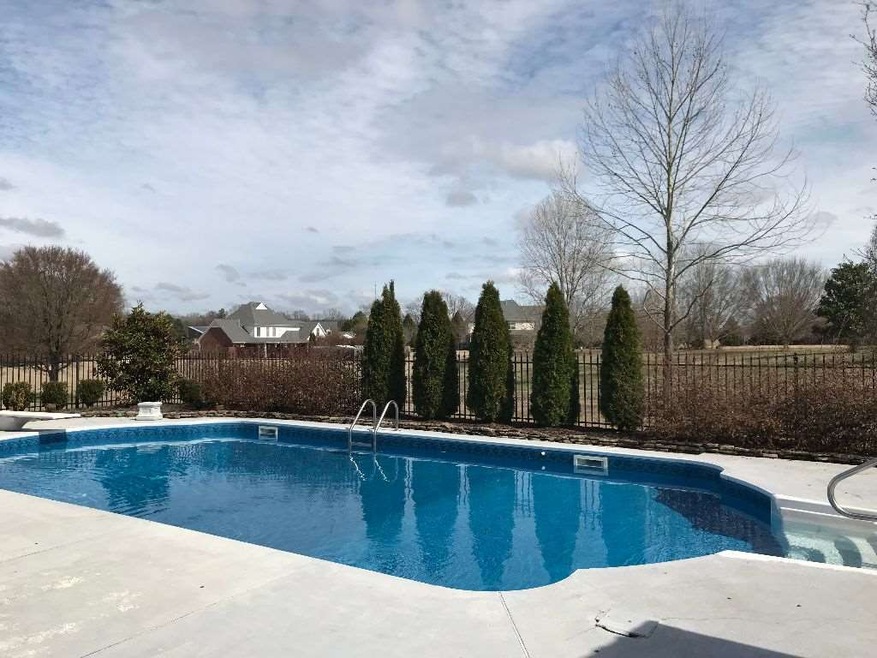 Set on a private 2.5 acre lot this 4BR/4Full bath 