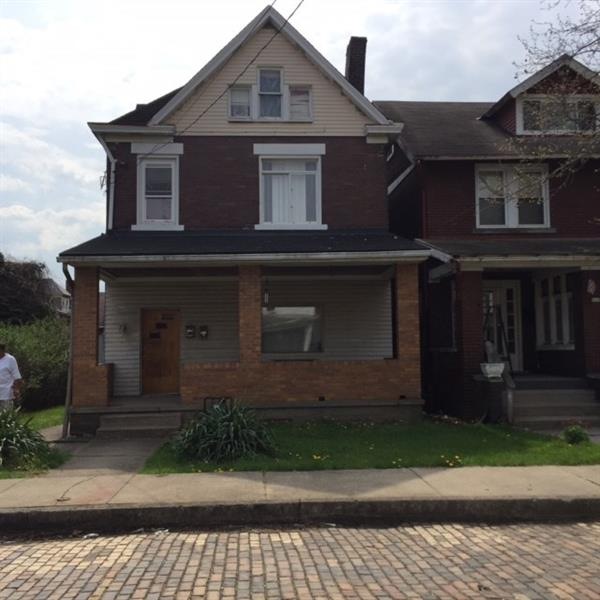 Nice Brick duplex with siding on front porch.  Goo