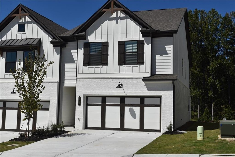 Modern farmhouse style home with a front yard and 