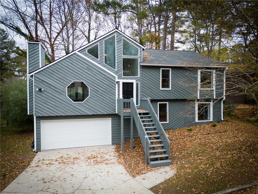 View of front facade featuring a garage