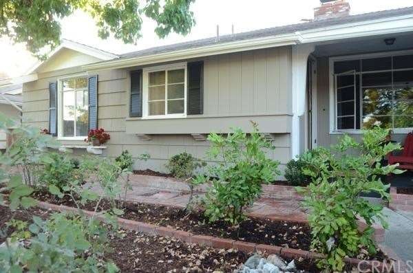 View of the front of the home newly painted and la