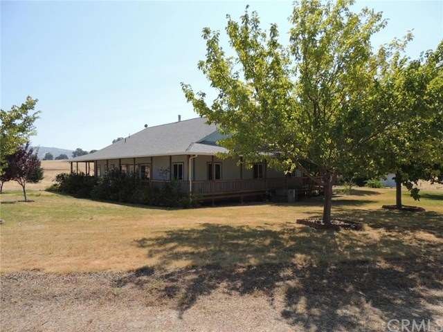 Ranch style home with wrap around deck and numerou