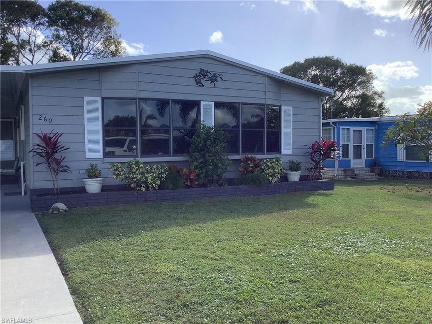 Front  view of house featuring a yard