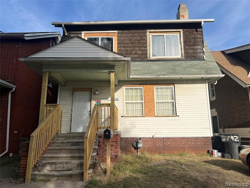 View of front of home featuring a chimney