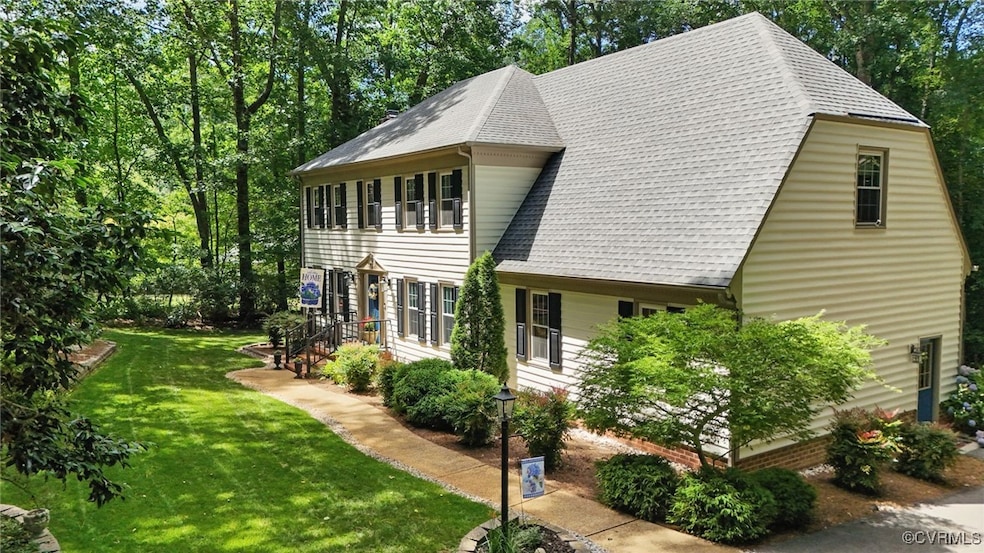 View of side of property with roof with shingles a