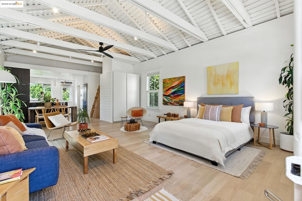 Bedroom featuring high vaulted ceiling, wood finished floors, and a wood ceiling with exposed beams