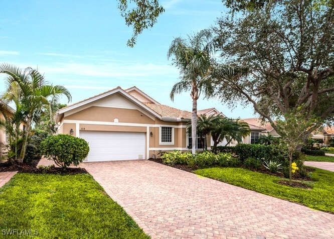View of front of property featuring a garage and a