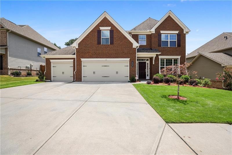 Three Car Garage Brick Beauty!