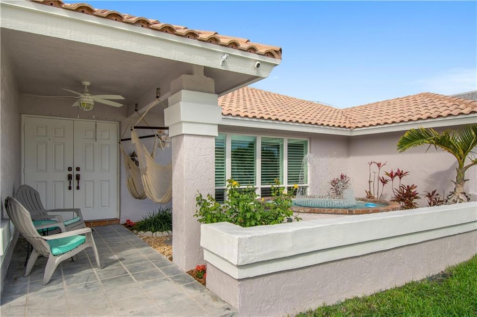 Inviting entrance with calming fountain and garden
