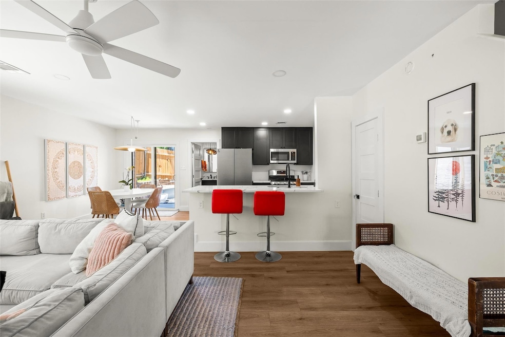 Living area featuring ceiling fan, recessed light