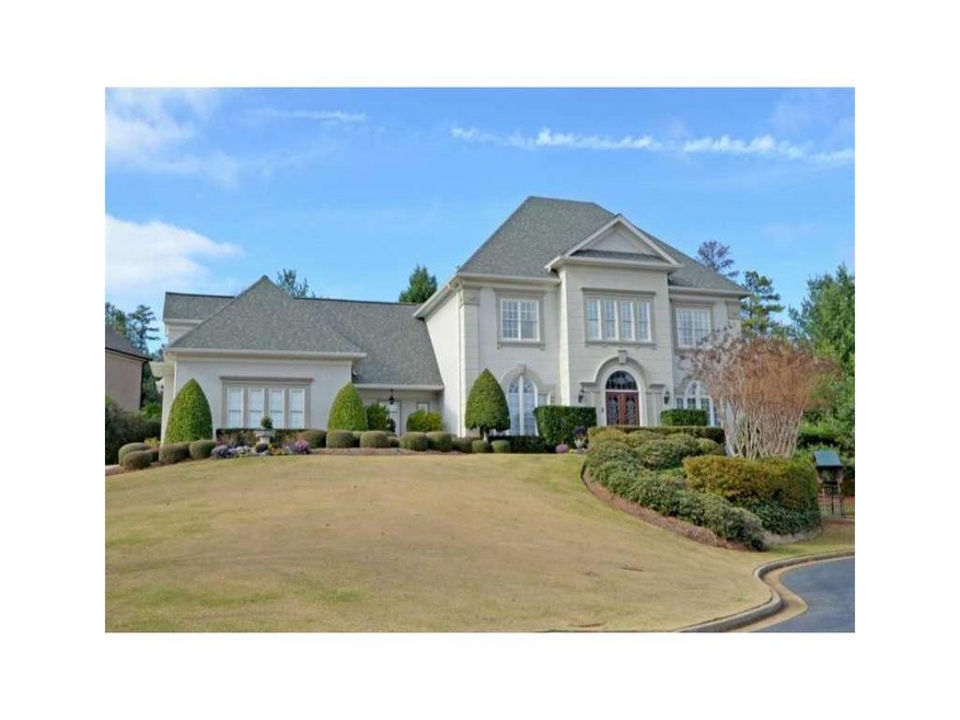 Exterior Front. Impressive hardcoat stucco home on