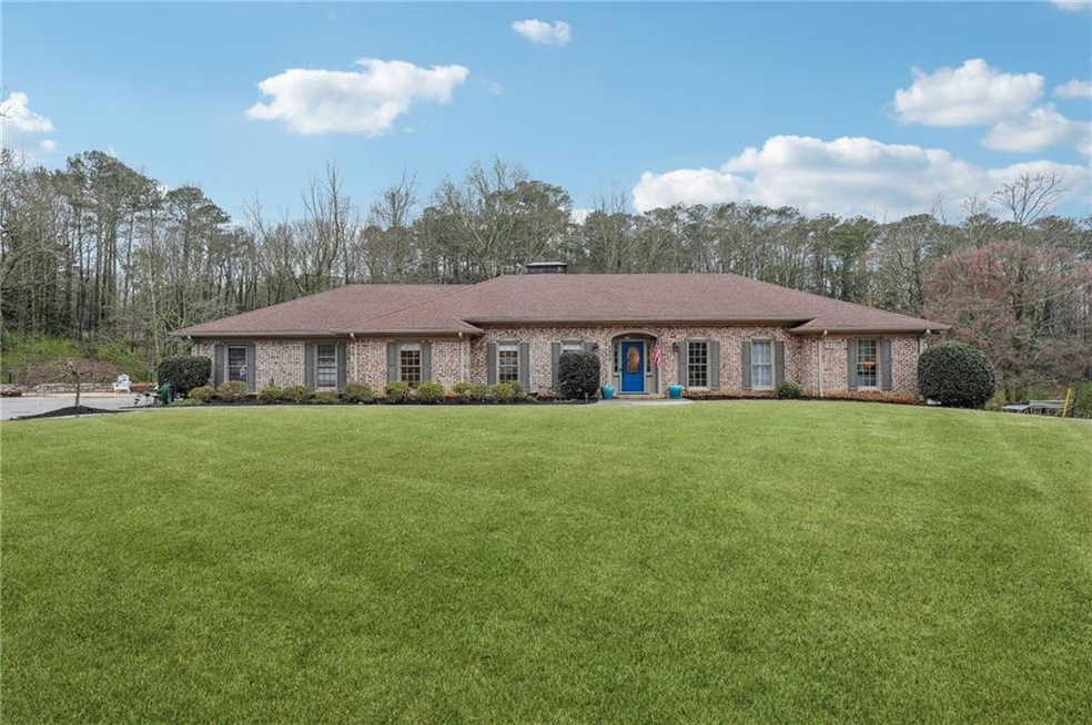 Beautiful 4 sided brick ranch on 2.89 acres