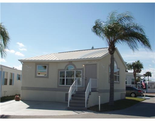 Exterior Front. A side view, the large window is l
