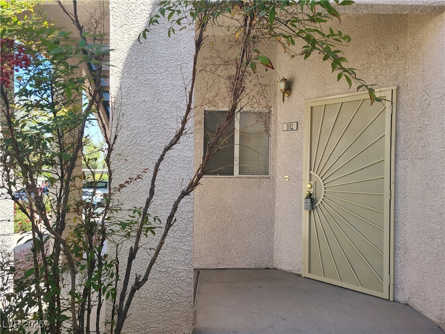 Property entrance featuring stucco siding