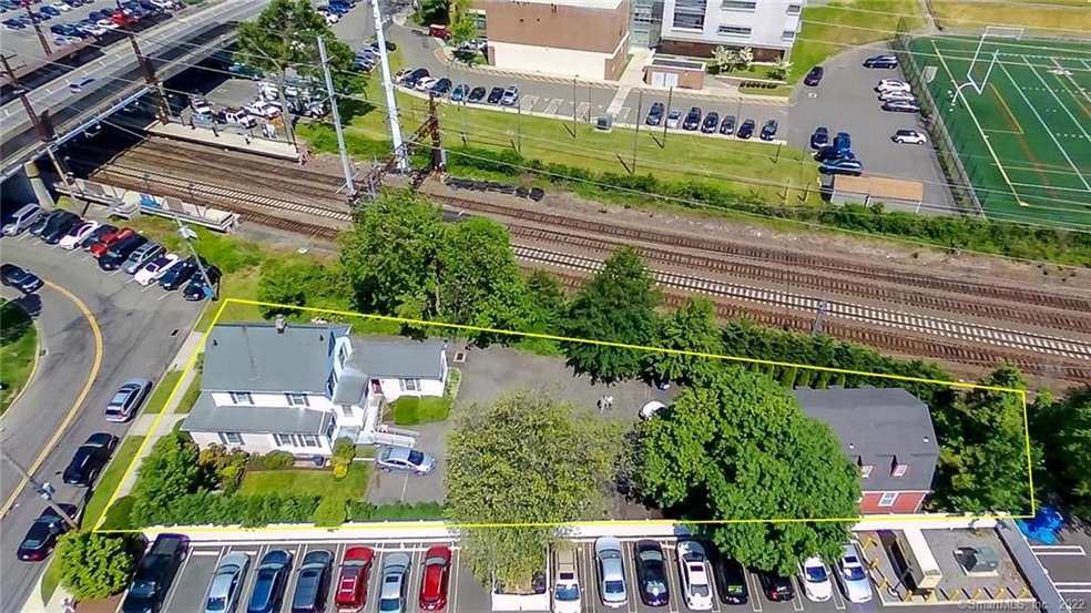 Adjacent to southbound train station.