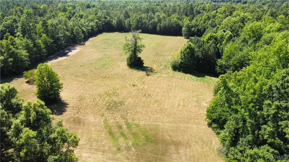 Birds eye view of property featuring a rural view