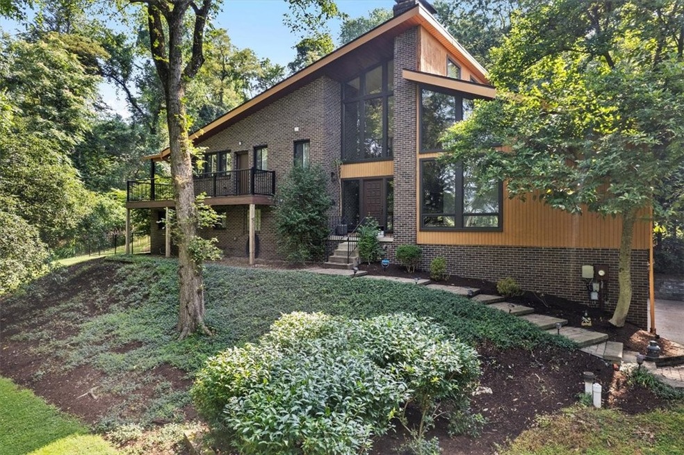 Welcome Home! Privacy galore in this custom Contem