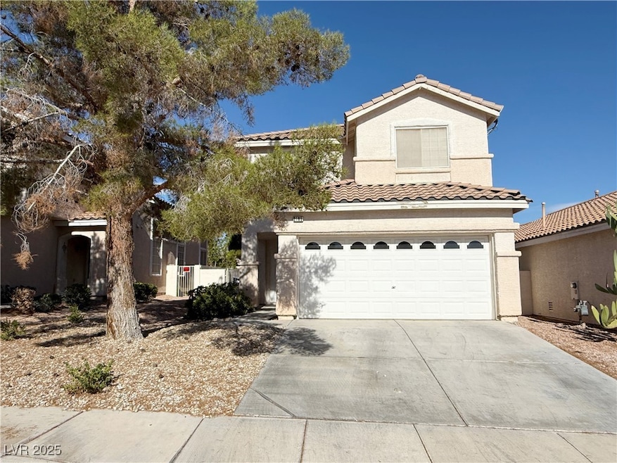 View of front facade featuring concrete driveway,