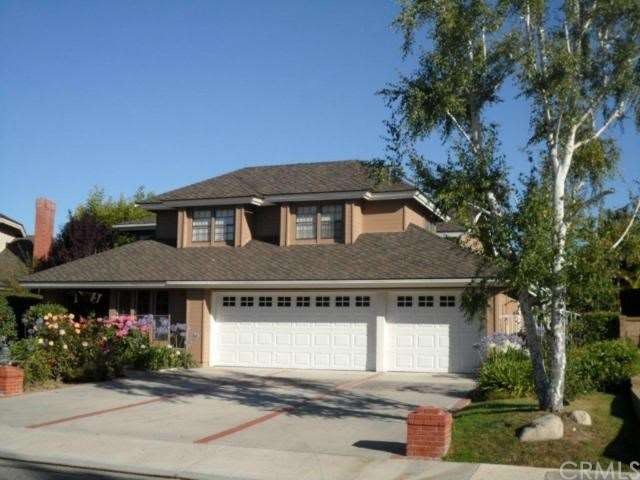 Front view of home with beautiful landscaping and 