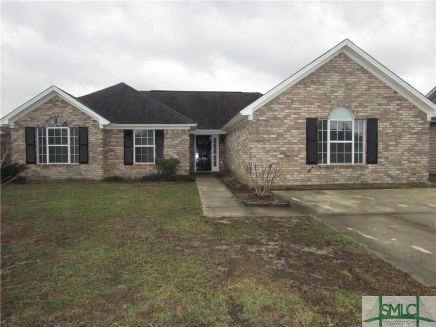 Exterior Front. Large Front Yard w/ Large Driveway
