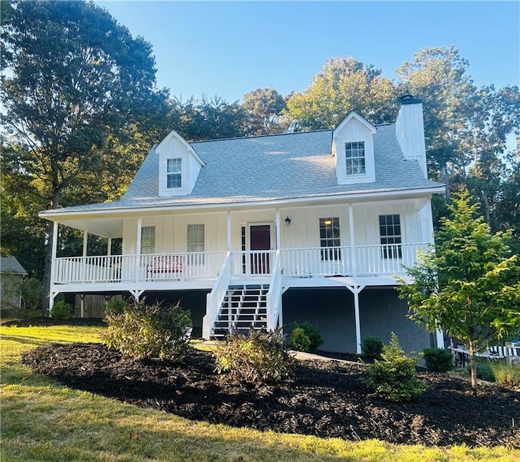View of front of property with a shingled roof, co