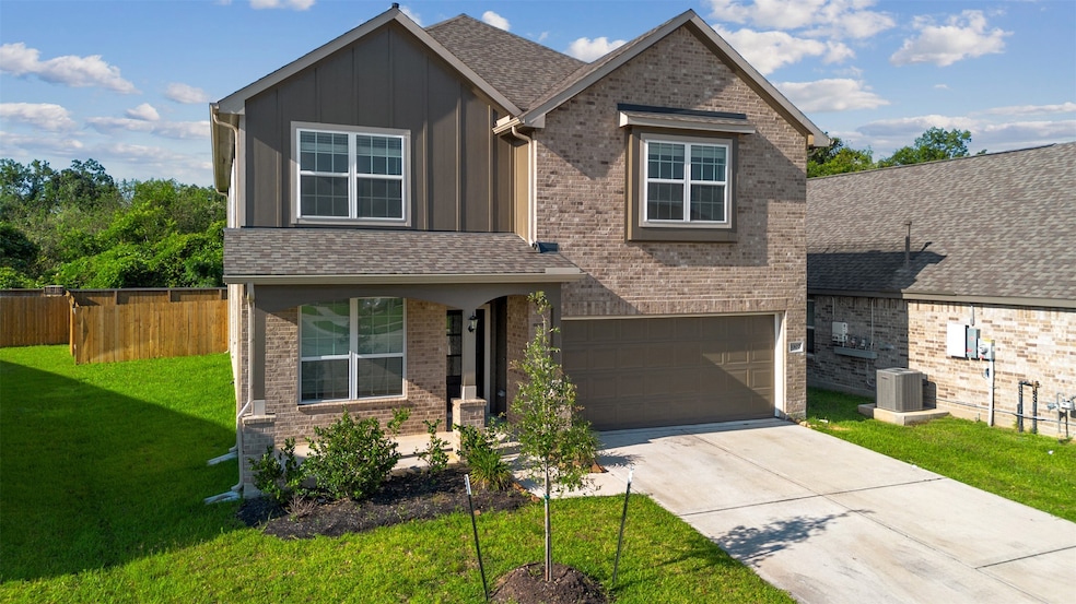 This is a modern two-story home with a brick exter