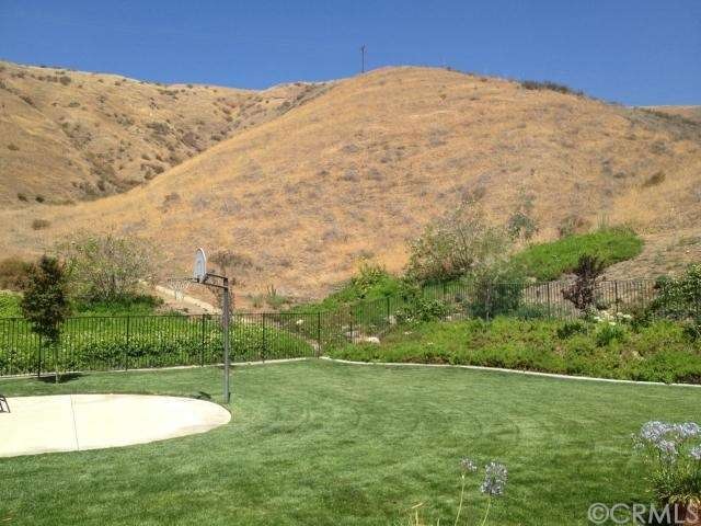 Backyard with basketball court area