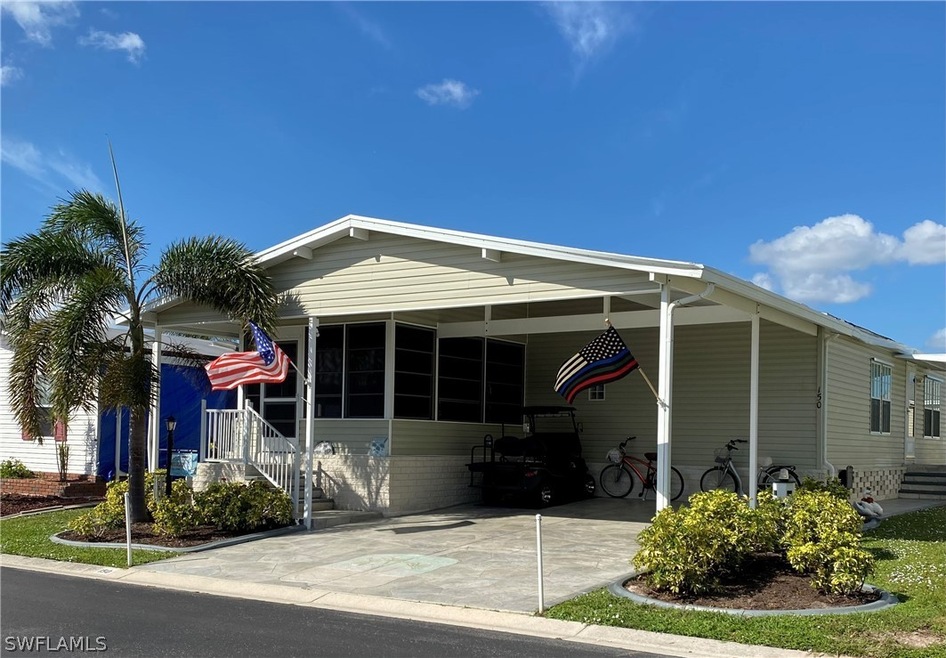 Front w/Dbl Covered Carport