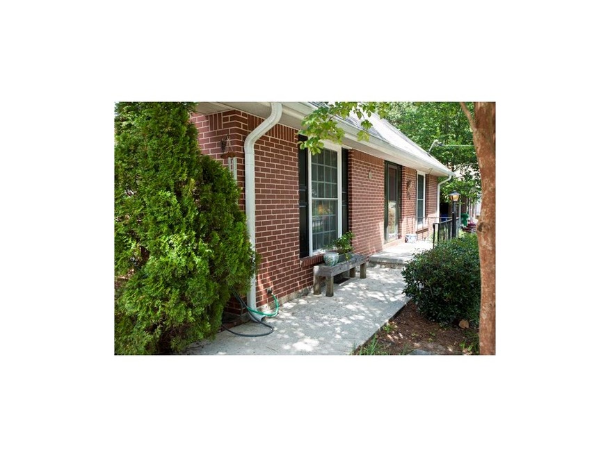 Welcoming walkway to the front door of this charming updated Cape Cod style home.