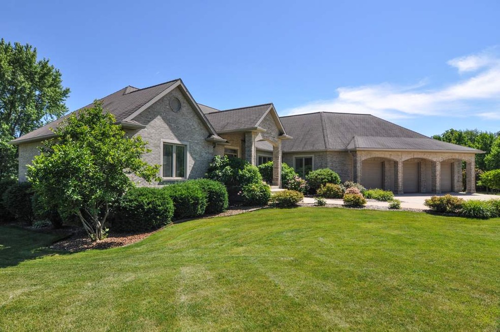 Custom all brick walk out ranch style home.