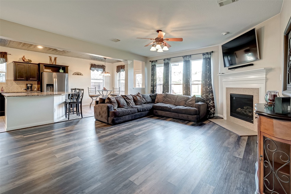 This wonderful view displays this open concept area perfect for entertaining.