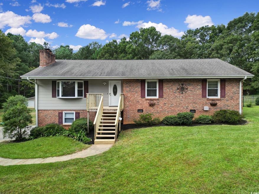 View of front of home featuring a front lawn