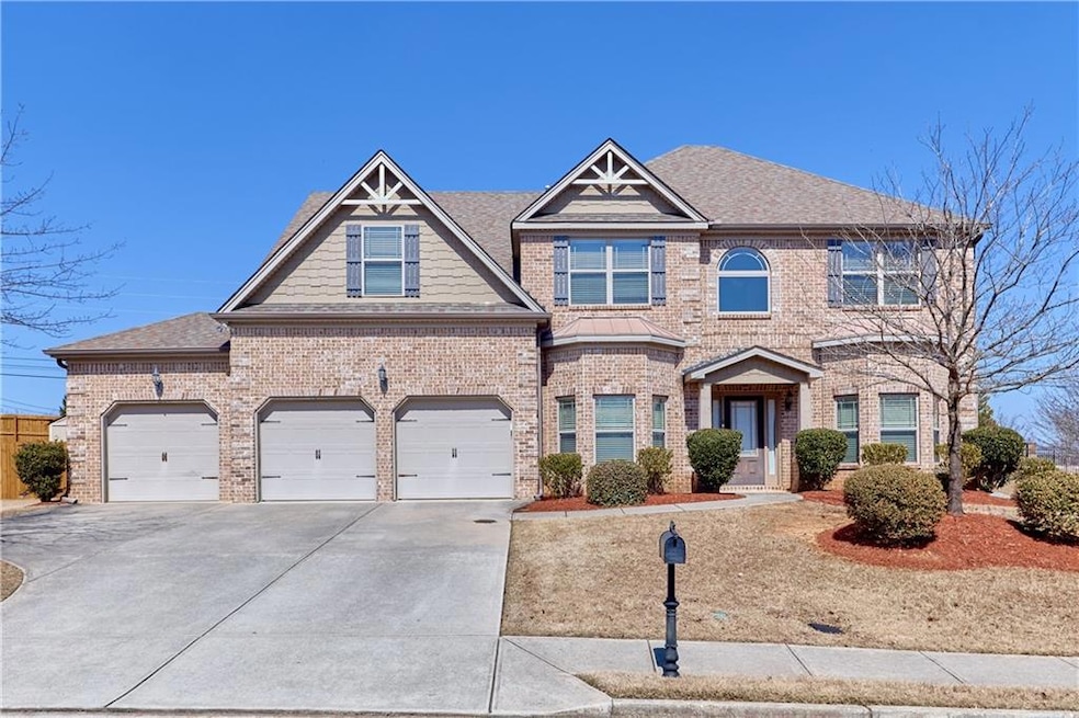 View of front of property with brick siding, drive