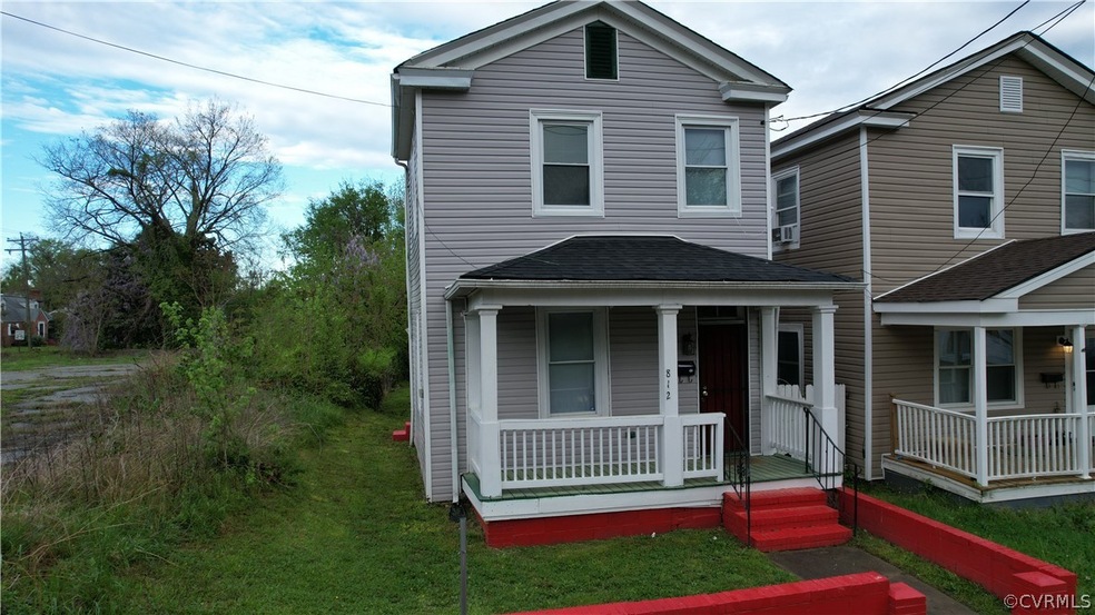 View of front property with covered porch and a fr